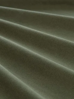 Polo en coton kaki uni pourvu d'un col boutonnée et de manches courtes
