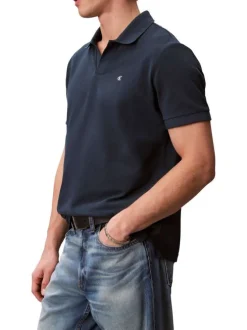 Polo en coton marine à coupe droite pourvu d'un col v bord-côte