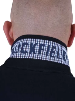 Polo en coton marine uni avec une coupe droite et un col à revers