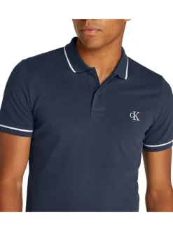 Polo en coton marine uni avec une coupe droite et une fermeture boutonnée