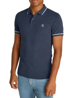 Polo en coton marine uni avec une coupe droite et une fermeture boutonnée