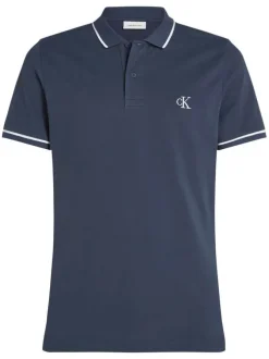 Polo en coton marine uni avec une coupe droite et une fermeture boutonnée