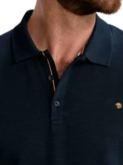 Polo en coton marine uni pourvu de manches courtes et d'un col boutonné