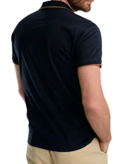 Polo en coton marine uni pourvu de manches courtes et d'un col boutonné