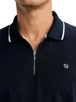Polo en coton marine uni pourvu de manches courtes et d'un col zippé