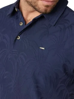 Polo en coton marine uni pourvu d'une coupe droite et d'un col boutonné