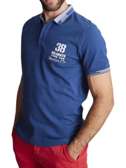 Polo en coton mélangé bleu uni à coupe droite imprimé à la poitrine gauche