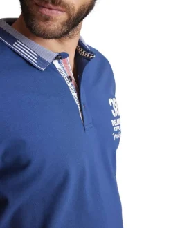 Polo en coton mélangé bleu uni à coupe droite imprimé à la poitrine gauche