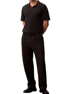 Polo en coton noir à coupe droite pourvu d'un col à revers boutonné