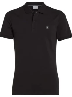 Polo en coton noir uni avec un col boutonné et une coupe droite
