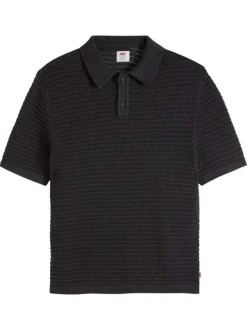 Polo en coton noir uni avec une coupe droite et un col boutonné