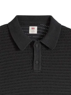 Polo en coton noir uni avec une coupe droite et un col boutonné