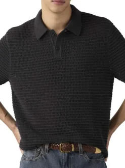 Polo en coton noir uni avec une coupe droite et un col boutonné