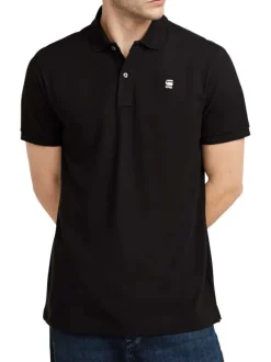 Polo en coton noir uni avec une coupe droite et un col boutonné