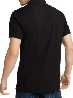 Polo en coton noir uni avec une coupe droite et un col boutonné