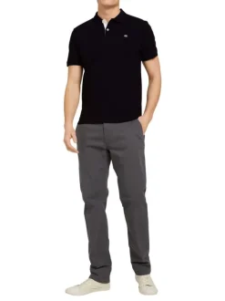 Polo en coton noir uni coupe droite avec un col boutonné et en maille piquée