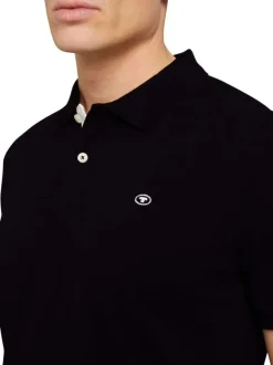 Polo en coton noir uni coupe droite avec un col boutonné et en maille piquée
