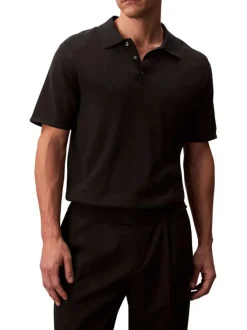 Polo en coton noir uni à coupe légèrement oversize avec le logo brodé