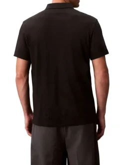 Polo en coton noir uni à coupe regular fit avec le mini logo brodé