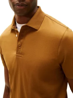 Polo en coton orange à coupe ajustée pourvu d'un col boutonné