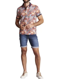 Polo en coton orange fleuri à coupe slim fit et à col fermé par trois boutons