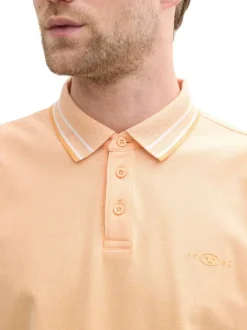 Polo en coton orange uni à coupe regular fit avec des liserés sur le col