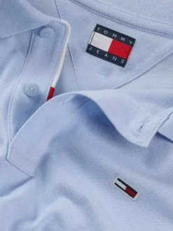 Polo en coton régénératif bleu uni à coupe droite, logo et col boutonné