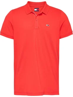 Polo en coton régénératif orange uni avec une coupe droite, col boutonné et logo