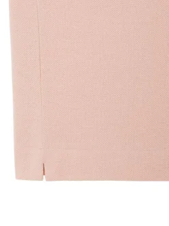 Polo en coton rose à coupe droite pourvu d'un col à revers boutonné