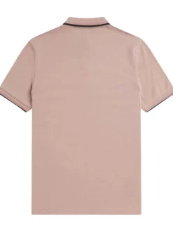 Polo en coton rose uni avec un col à deux boutons roses et une coupe droite