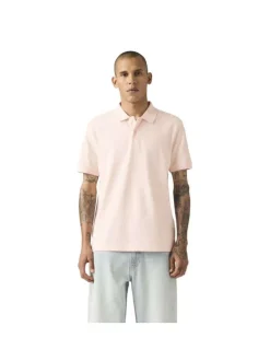 Polo en coton rose uni avec une coupe droite et un col boutonné