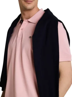 Polo en coton rose uni pourvu d'un col boutonné et de manches courtes