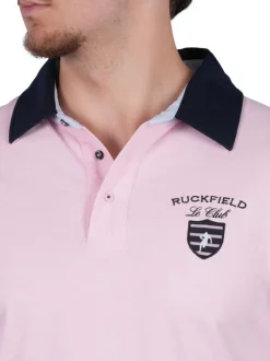 Polo en coton rose uni pourvu d'une coupe droite et d'un col boutonné
