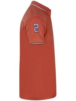 Polo en coton saumon uni avec logo de la marque et un col boutonné