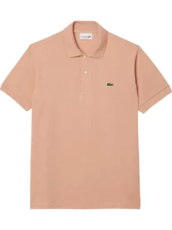 Polo en coton saumon uni avec une coupe regular fit et le petit crocodile brodé