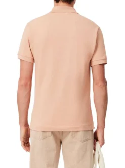 Polo en coton saumon uni avec une coupe regular fit et le petit crocodile brodé