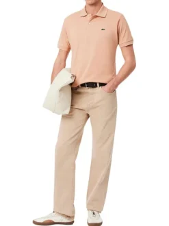 Polo en coton saumon uni avec une coupe regular fit et le petit crocodile brodé