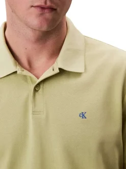 Polo en coton vert pistache uni à coupe slim avec le logo brodé en petit