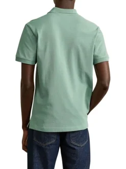 Polo en coton vert uni avec une coupe droite et un col boutonné
