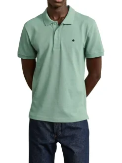 Polo en coton vert uni avec une coupe droite et un col boutonné