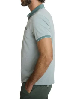 Polo en coton vert uni avec une coupe droite et une poche passepoilée à l'avant
