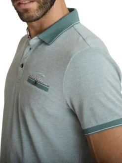 Polo en coton vert uni avec une coupe droite et une poche passepoilée à l'avant