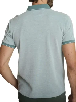 Polo en coton vert uni avec une coupe droite et une poche passepoilée à l'avant