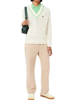 Polo en coton vert uni avec une coupe regular fit et le petit crocodile brodé