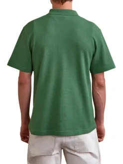 Polo en coton vert uni avec un logo brodé et un col boutonné