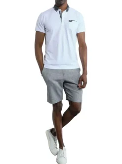 Polo à manches courtes en coton blanc uni à coupe droite et col boutonné
