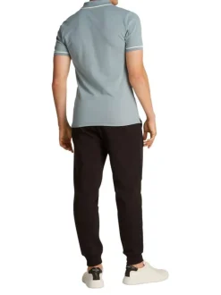 Polo à manches courtes en coton bleu uni à coupe ajustée avec des liserés blancs