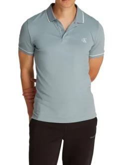 Polo à manches courtes en coton bleu uni à coupe ajustée avec des liserés blancs