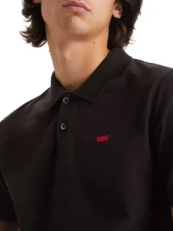 Polo manches courtes, en coton noir uni, à col 2 boutons et coupe slim