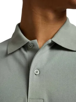 Polo à manches courtes en coton vert uni avec une coupe slim fit